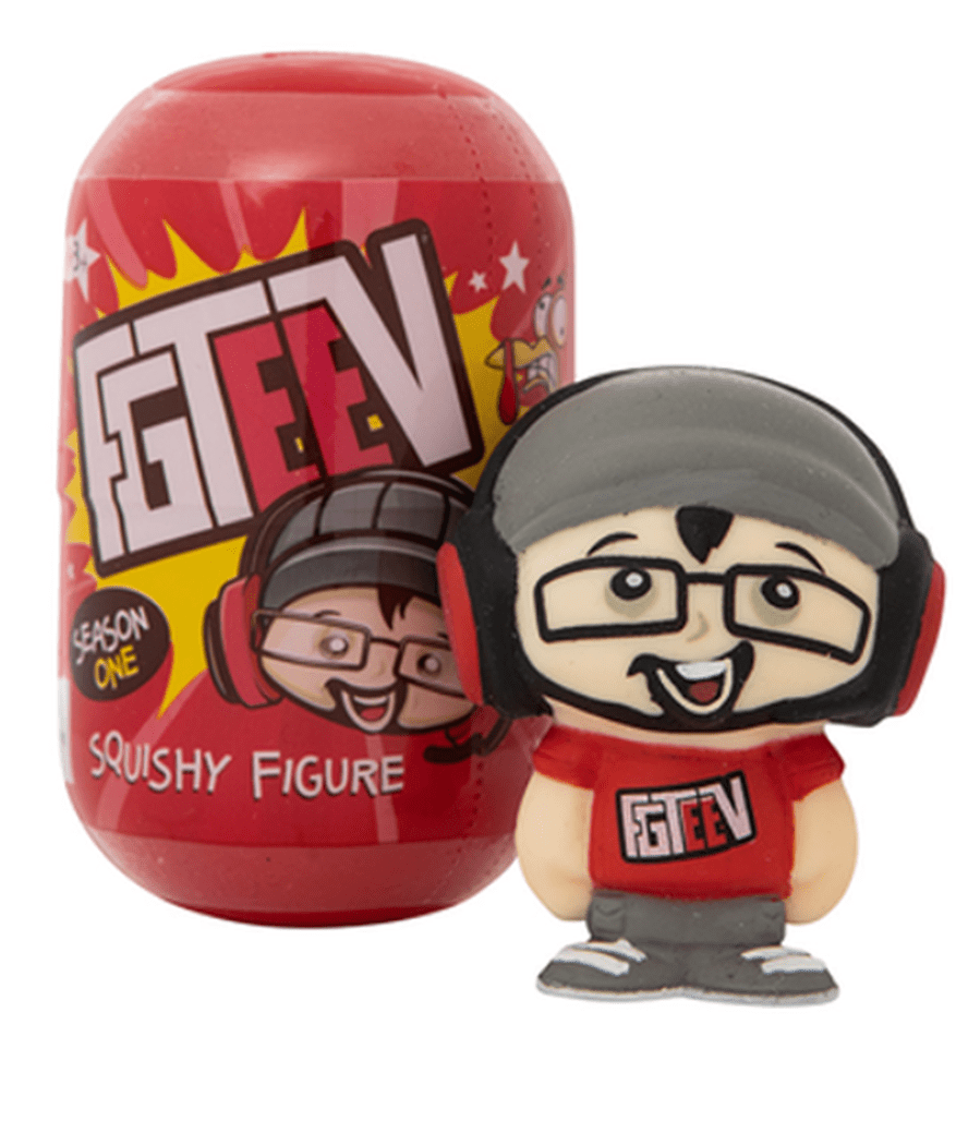 A collectible geek squishy figure with glasses and a beanie.