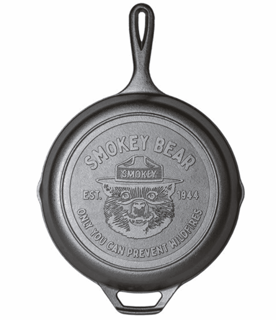Cast iron skillet featuring Smokey Bear's face and message.